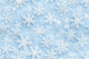 Seamless light blue background adorned with various white snowflakes, creating, a Texture Graphic by Textures & Backgrounds