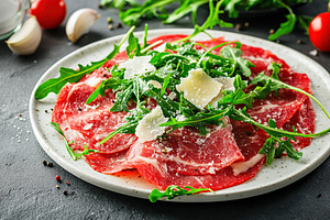 Beef carpaccio with arugula and parmesan on a rustic plate in a cozy restaurant, a Food & Drink Photo by AlyaAnd