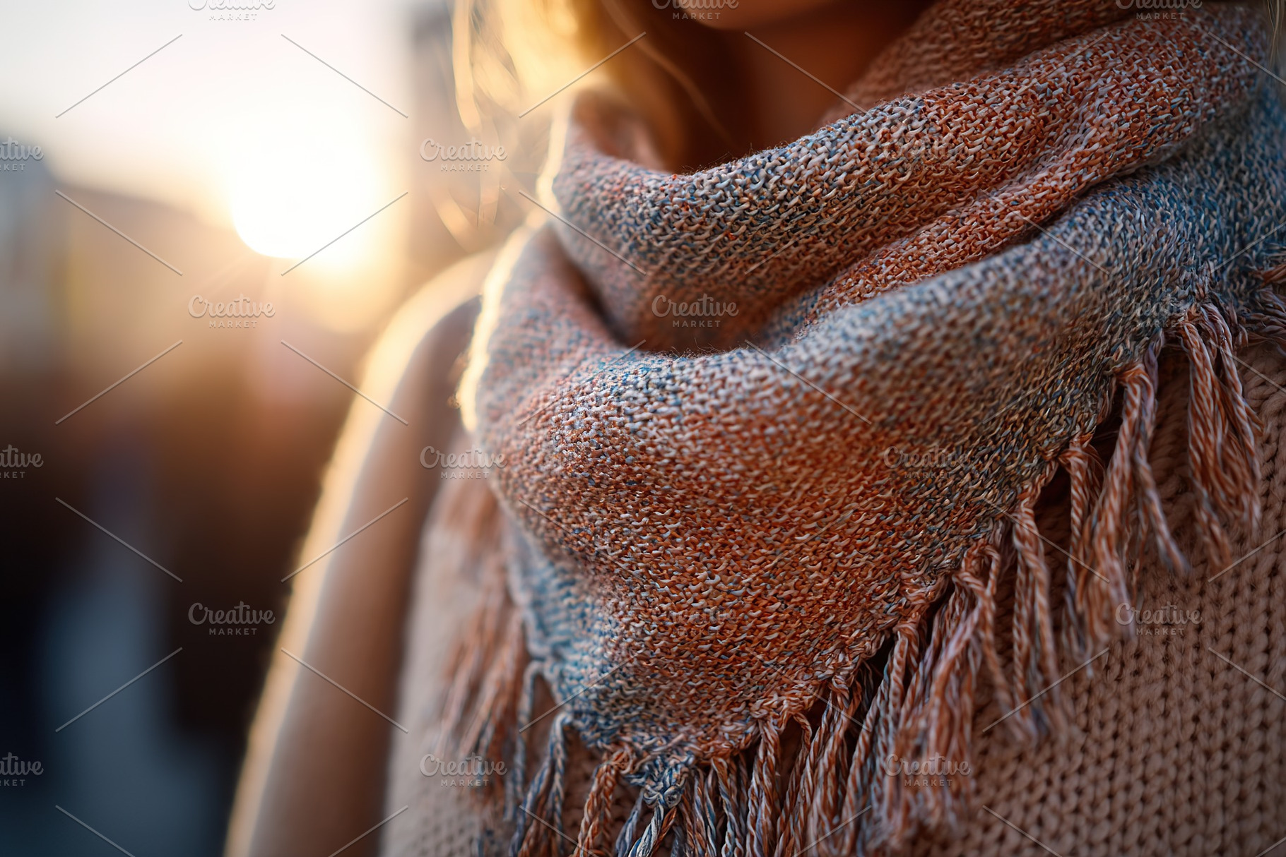 Warm scarf wrapped around person walking under soft fading sunlight at sunset, a Beauty & Fashion Photo by AlyaAnd