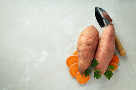 Concept of vegetables, sweet potato, space for text, a Food & Drink Photo by AtlasStudio PRO