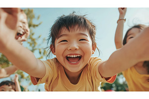 Happy Asian child in a yellow shirt, a Nature Photo by Sergey Kotenev