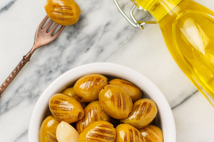 Grilled green olives