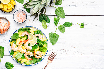 Fresh pineapple shrimp salad with spinach, avocado and lime on w, a Food & Drink Photo by 5PH