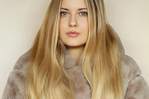 Young adult woman posing for a portrait, showcasing blonde long hair and a styl, a Person Photo by Studio ANNA