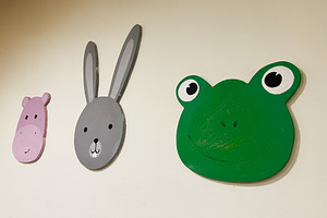 Animal face wall decorations featuring frog, rabbit, and hippo in playful desig, a Photo by AS photostudio