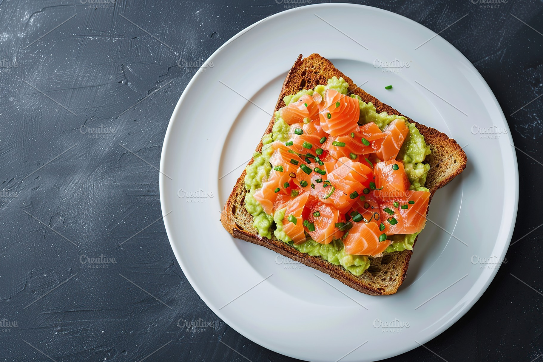 Toast bread with salted salmon and guacamole avocado on grey background, a Food & Drink Photo by AlyaAnd