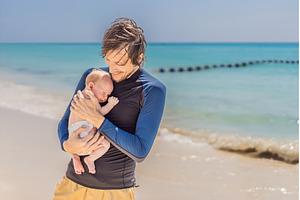 Father holding his newborn baby by, a Person Photo by Elizaveta Galitskaya