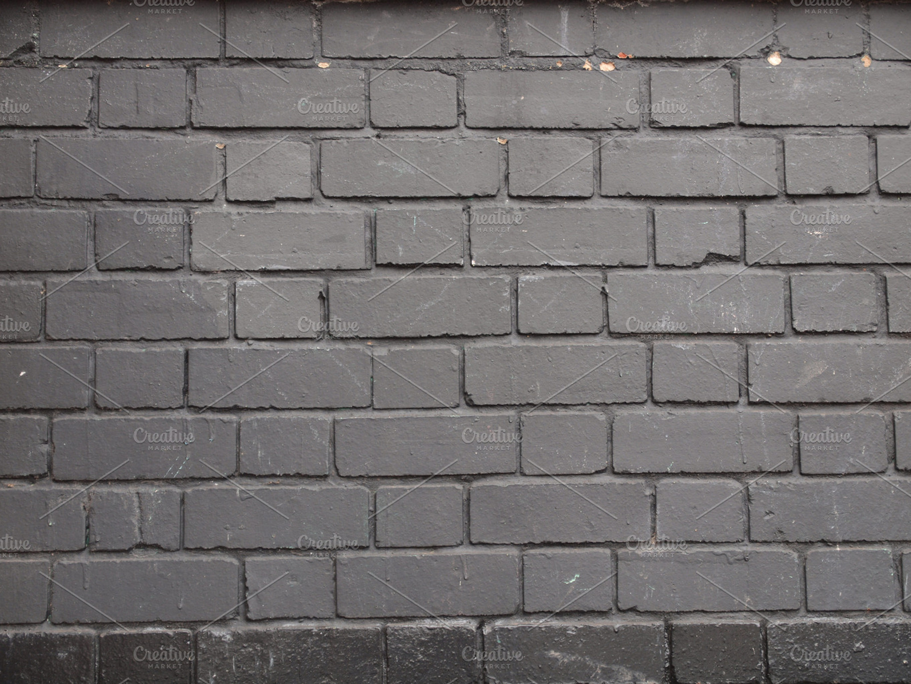 Black brick wall containing black, brick, and wall