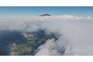 Mount Abang volcano peak emerging, a Nature Photo by Goinyk