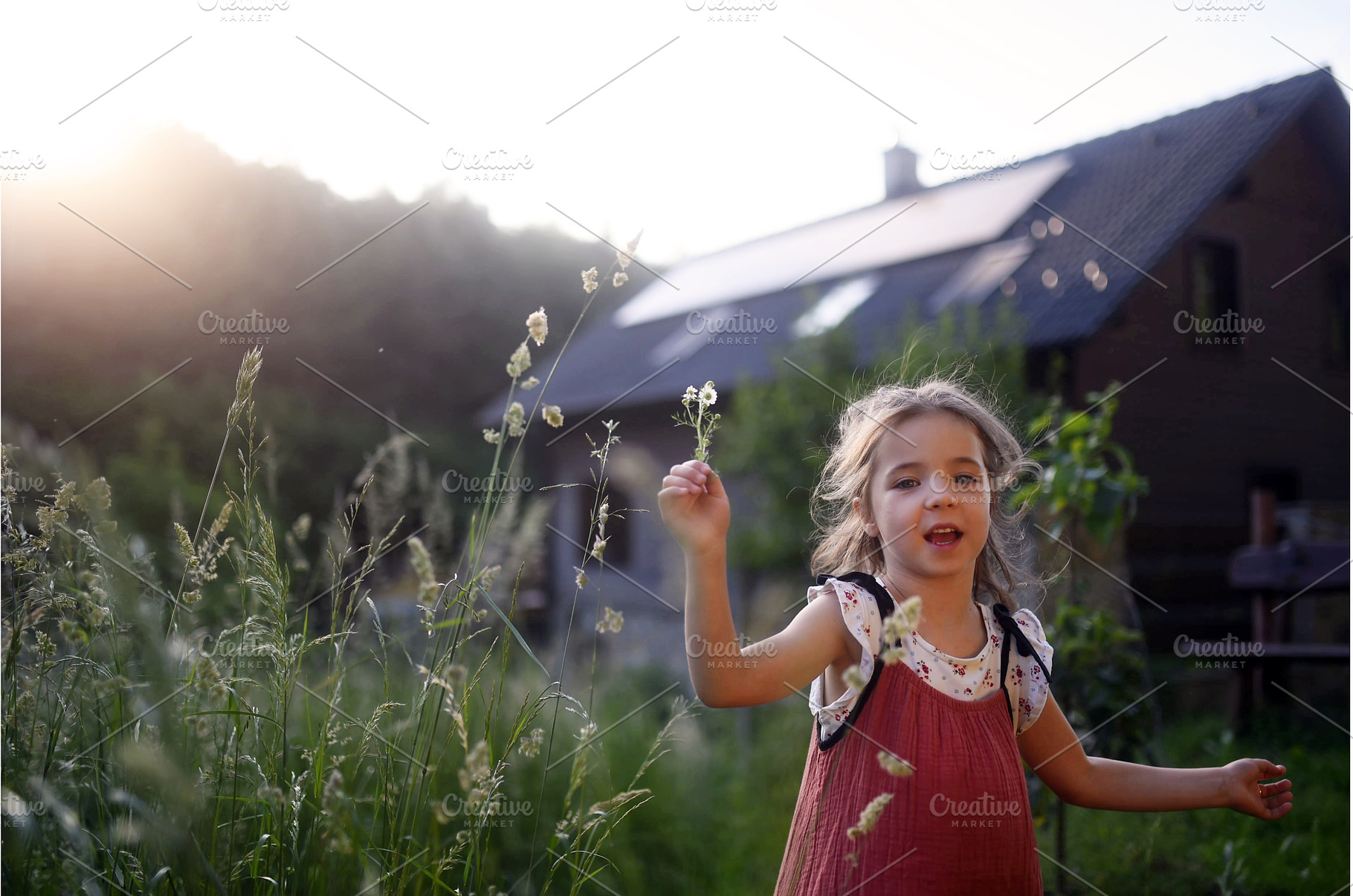 Girl in front of house with solar, a Person Photo by HalfPoint