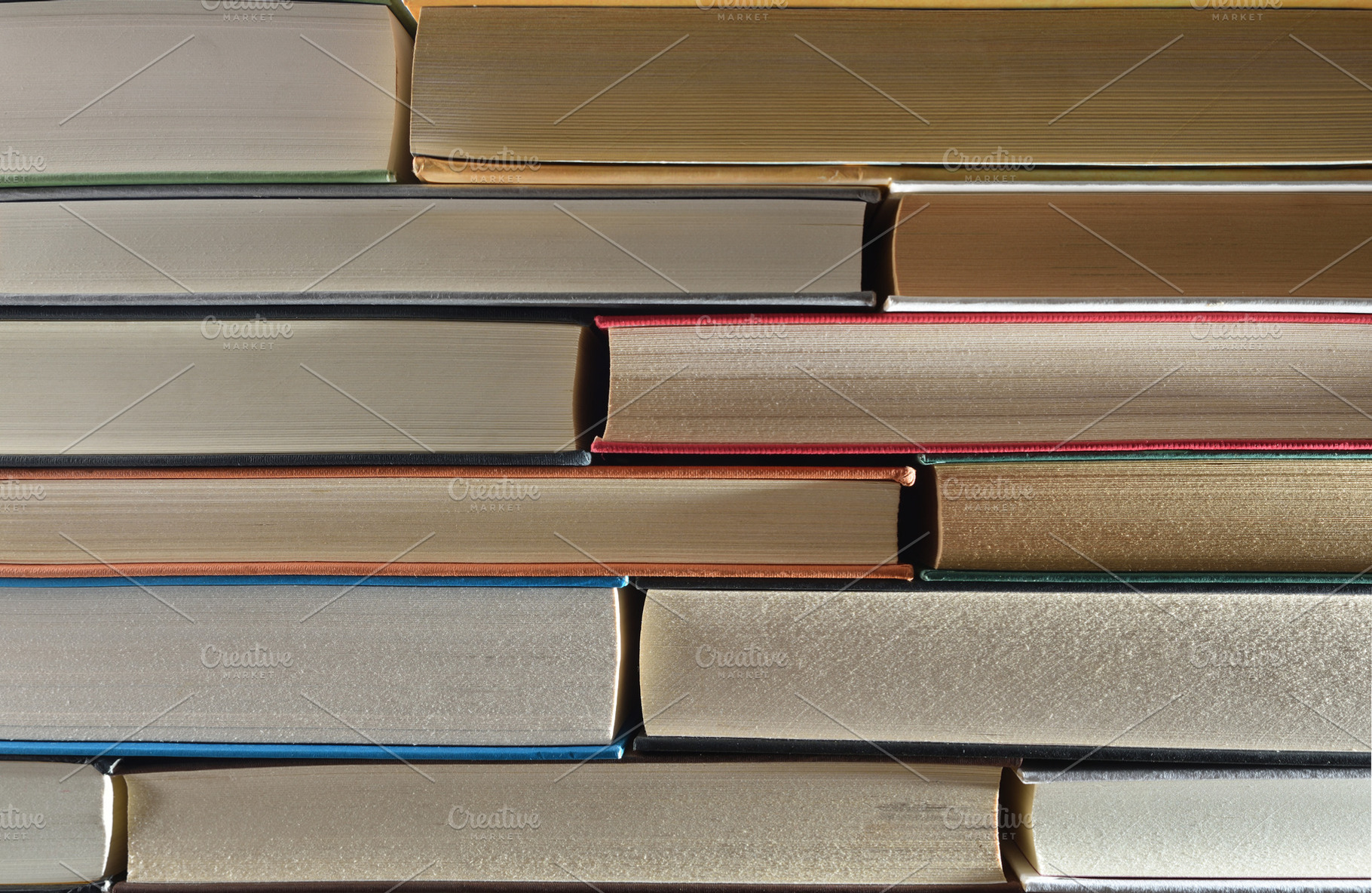 Detail of a stack of books showing the front edge, a School & Education Photo by Davizro's Market