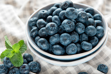 Blueberries on textile background, a Food & Drink Photo by Olena Rudo