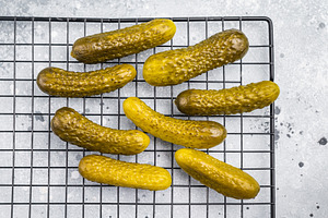 Crunchy pickled cucumbers, bursting with flavor, perfect for san, a Food & Drink Photo by composter-box@mail.ru