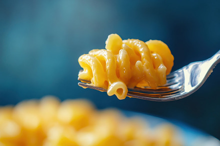 Creamy macaroni pasta on fork showca, a Photo by Iftikhar Alam