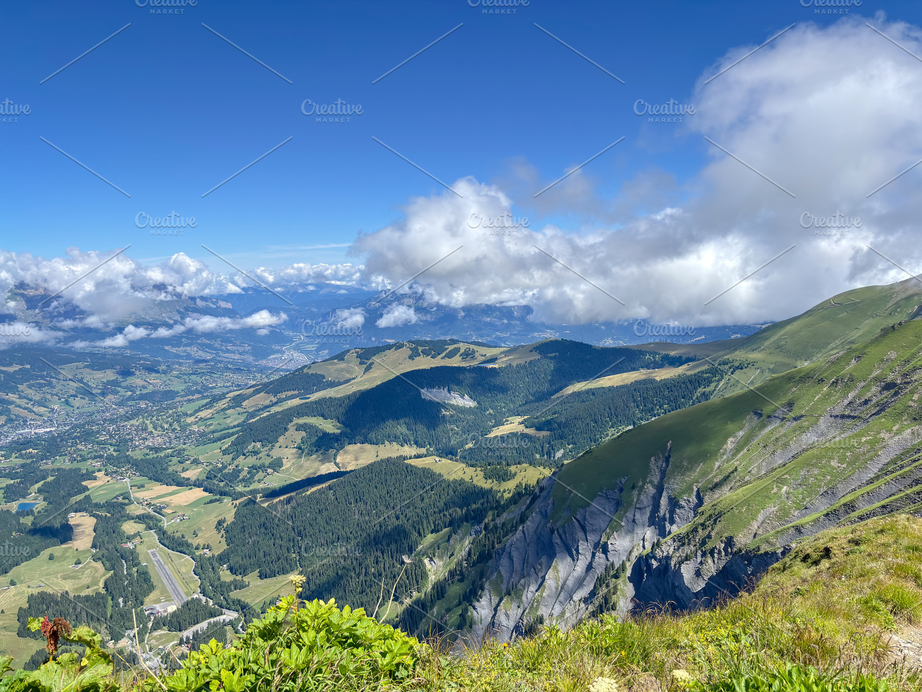Wide mountain and Megeve view over valleys from alpine ridge in, a Nature Photo by GoodGoods