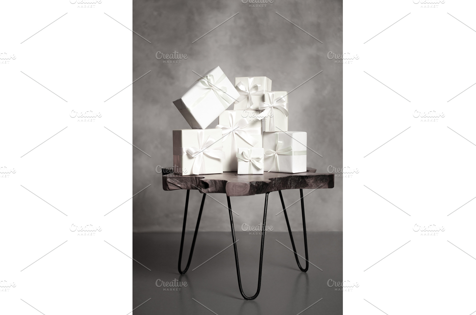White gifts with ribbons stacked on, a Holiday Photo by Anna Efetova