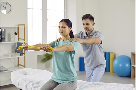 Young woman doing muscle, a Health & Medical Photo by StudioRomantic