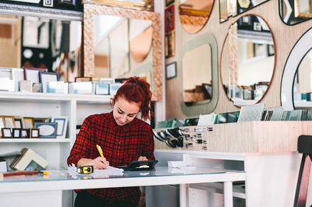 Woman shop assistant at work., a Person Photo by Photocreo Michal Bednarek