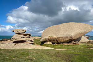 Balanced granite stacks beside large boulder in Tregastel Britta, a Nature Photo by GoodGoods