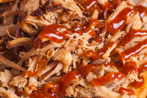 Pulled pork sandwich close up featuring appetite, barbeque, and bread