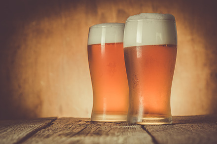 Beer in frosty mugs on rustic background containing beer, pub, and background, a Food & Drink Photo by NaumenkoOS