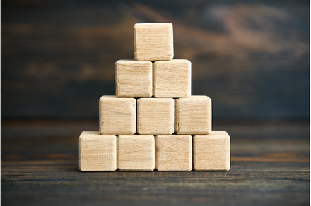 Pyramid of blank wooden cubes on