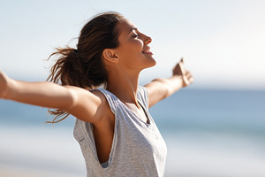 Joyful woman with outstretched arms, a Person Photo by MistyDay