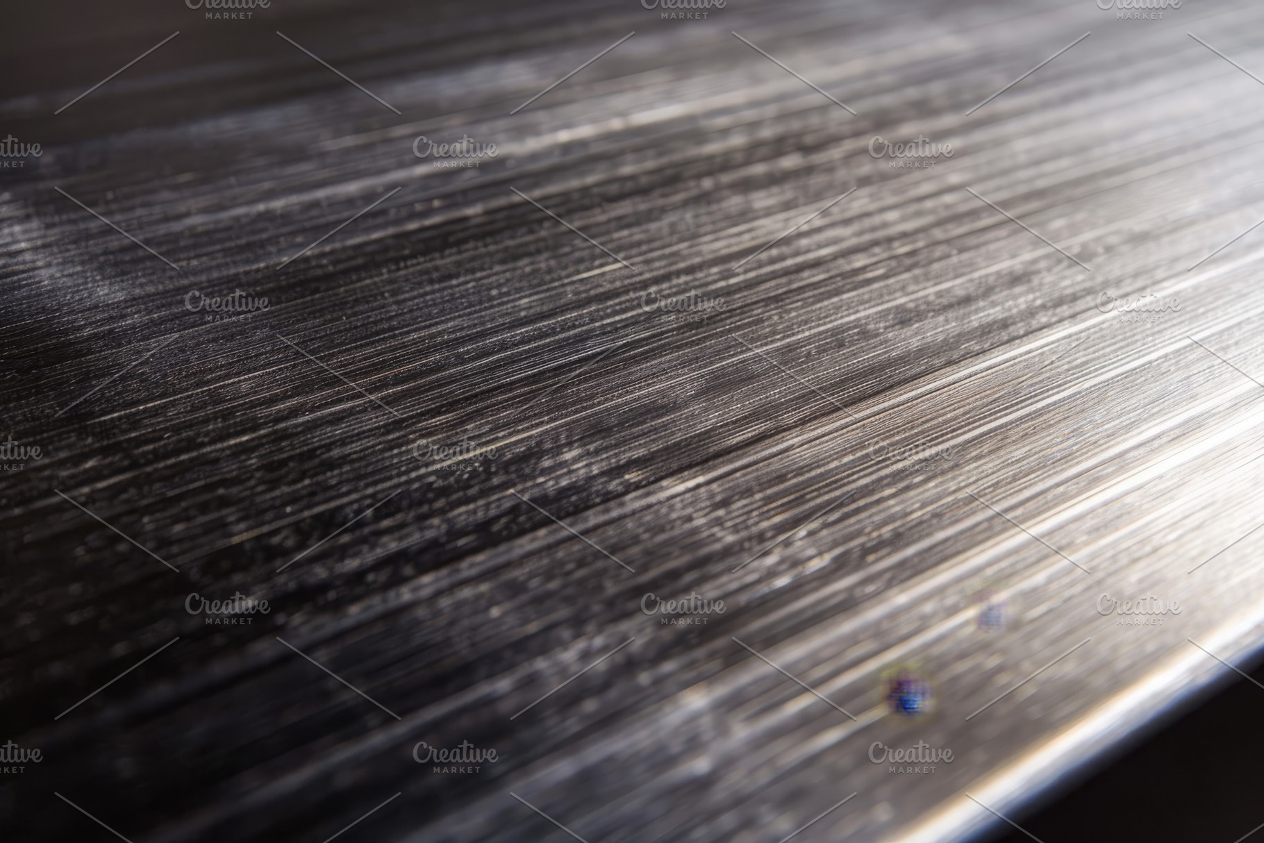 Detailed view of a brushed metal sur, a Photo by Iftikhar Alam