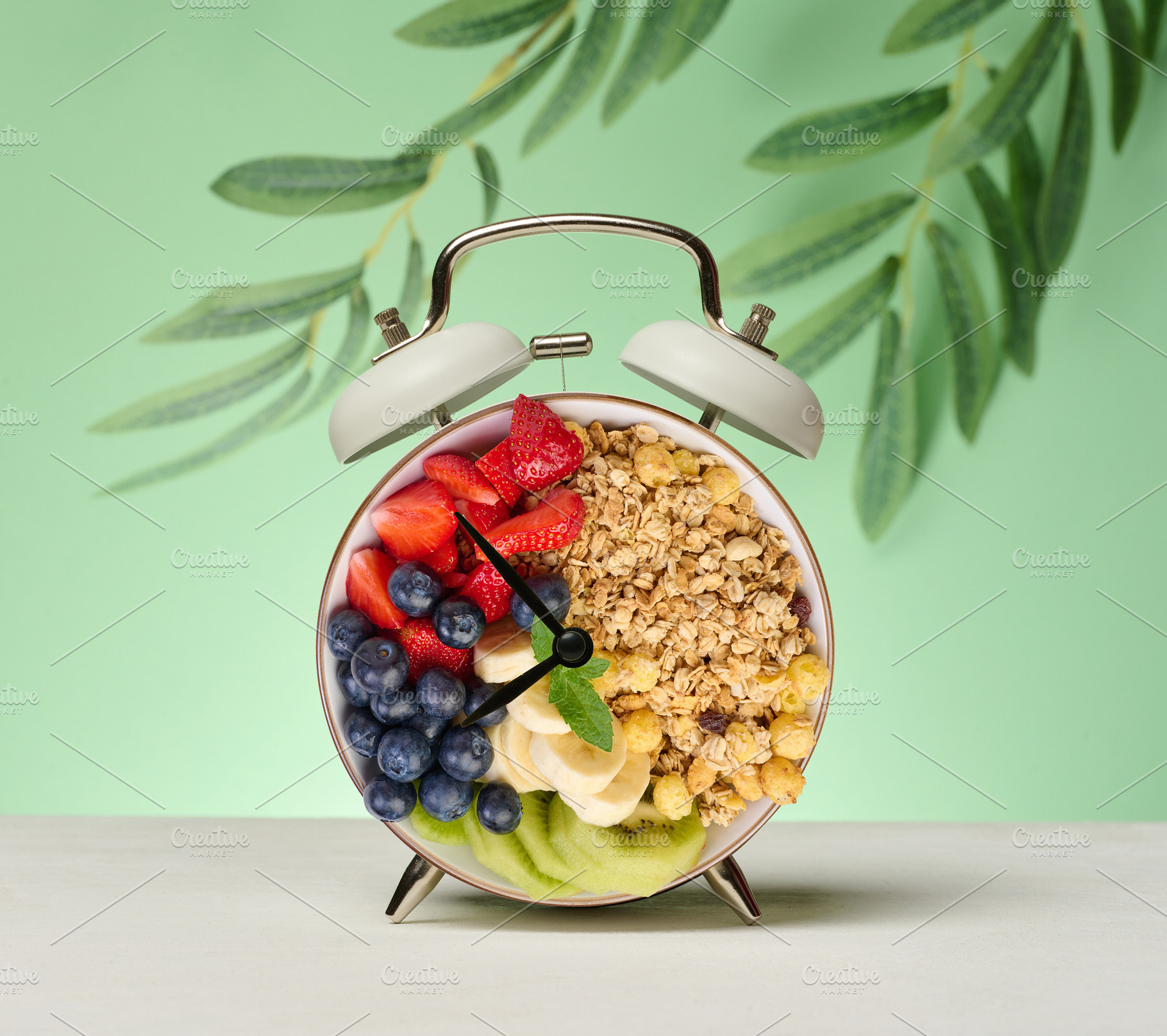 Alarm clock with a bowl instead of a clock face. The bowl is fil, a Food & Drink Photo by ndanko