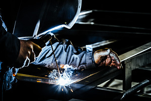 Professional man working on metal featuring welder, welding, and worker, an Industrial Photo by Shootdiem