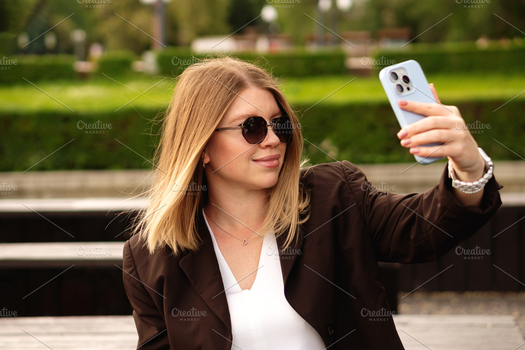 Young woman posing for selfie, a Person Photo by Elena Vagengeim