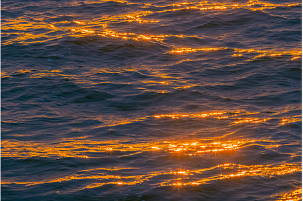 Beautiful sunset over the sea, an Abstract Photo by Lukas Jonaitis SHOP