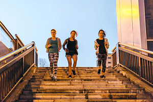 Women friends training running down stairs in town on sunset, a Sports & Recreation Photo by davidpereiras