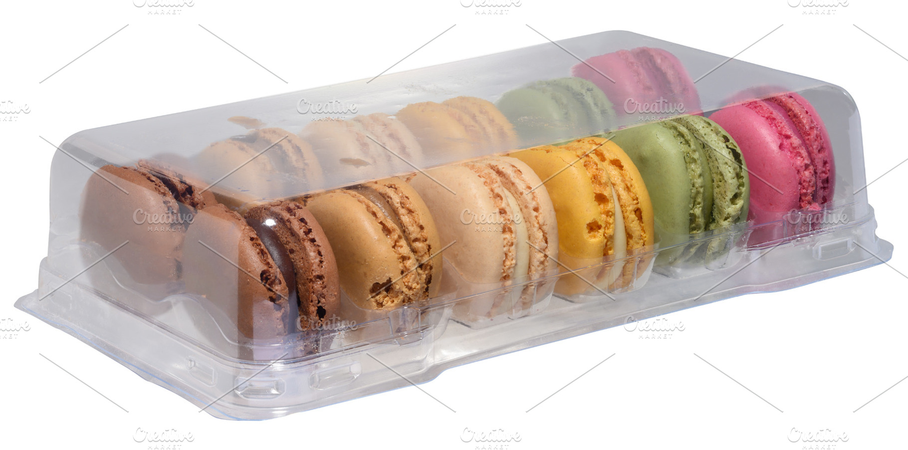 Set of colorful macaroons in transparent plastic packaging, isol, a Food & Drink Photo by ndanko