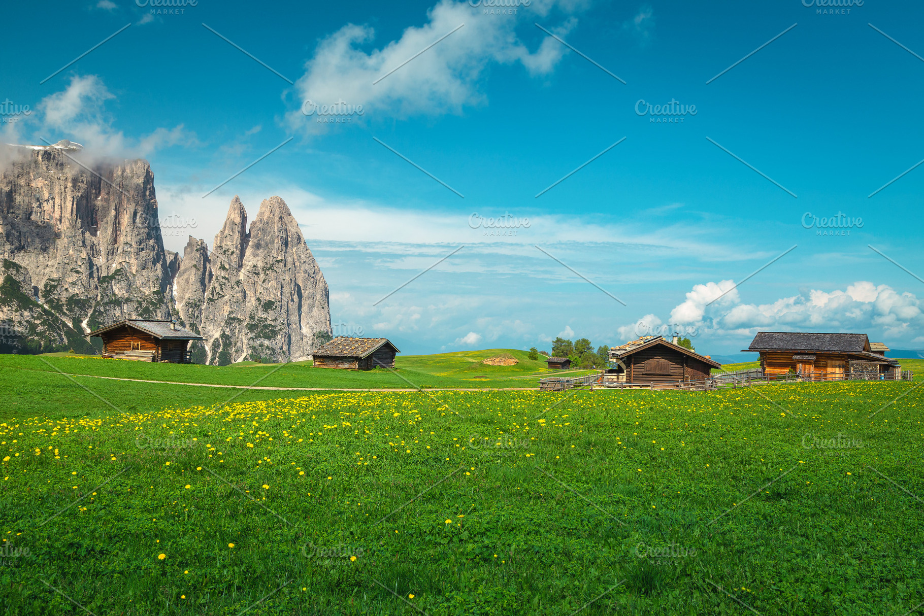 Wooden lodges on the fields, Italy, a Nature Photo by Alpine Dreams