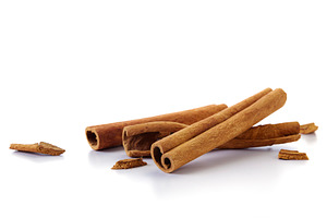 cinnamon sticks on white