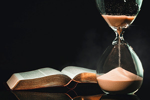 Hourglass and Holy Bible