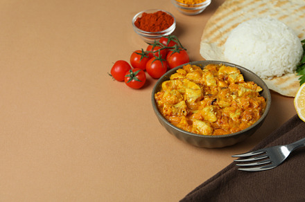 Concept of tasty food with chicken tikka on beige background, a Food & Drink Photo by AtlasStudio