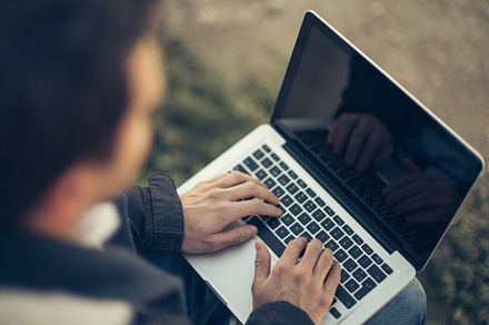 Man working at computer stock photo containing computer and man
