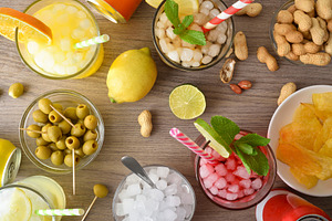 Refreshing drinks and snacks on wooden table top view, a Food & Drink Photo by Davizro's Market