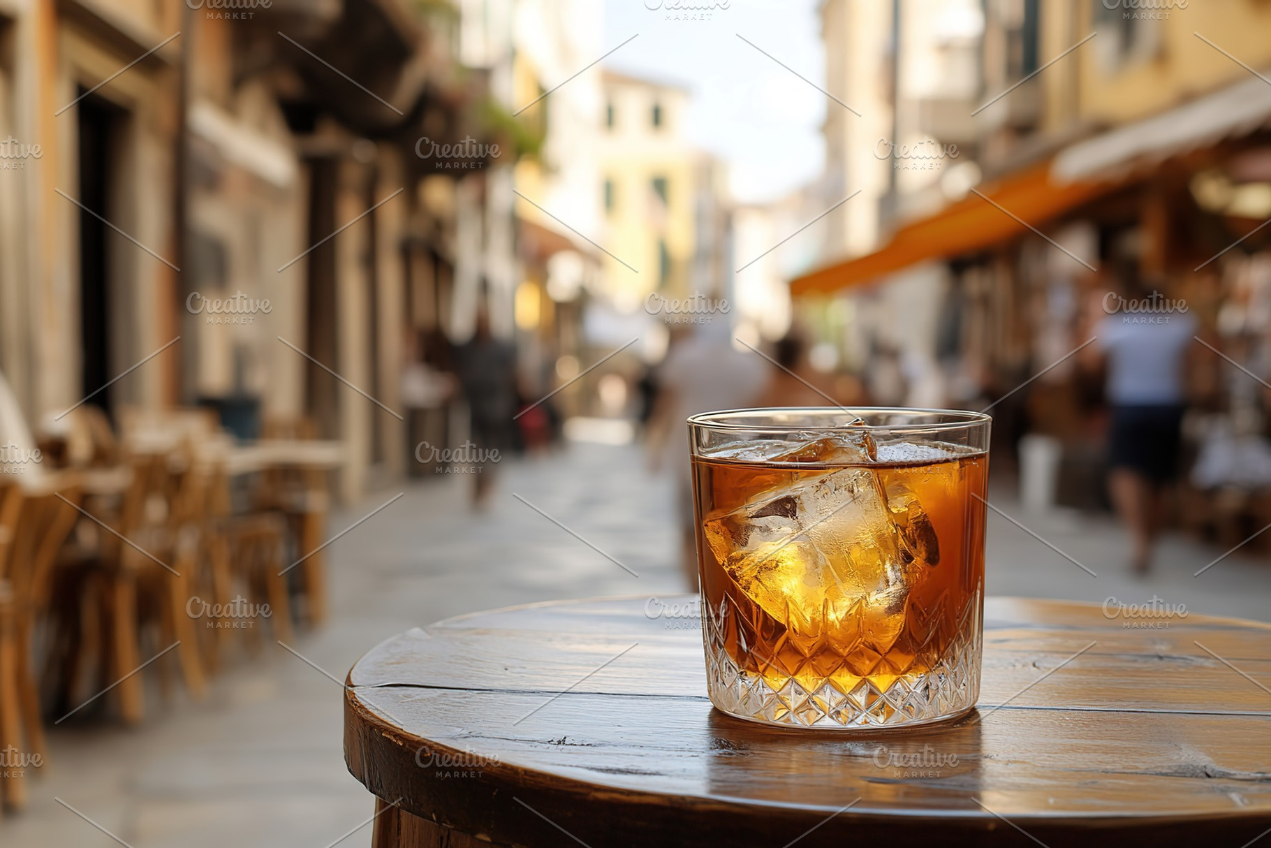 Alcoholic cocktail with ice cubes on table of italian sidewalk cafe, a Food & Drink Photo by AlyaAnd