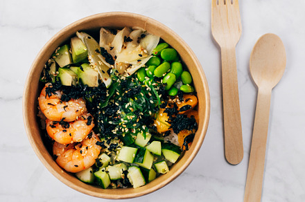 Poke bowl with shrimp, avocado, rice, mango and vegetables with sesame seeds, w, a Food & Drink Photo by Anikona