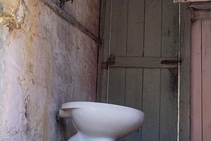 Rustic outdoor toilet with weathered walls, an Architecture Photo by DanFLCreativo