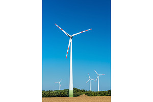 Turbines at a wind farm in austria stock photo containing wind and energy, a Technology Photo by Leonid Andronov