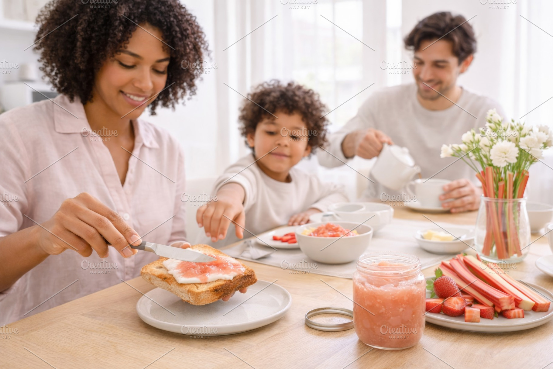 Family enjoying breakfast with rhuba, a Photo by Dvoevnore photos