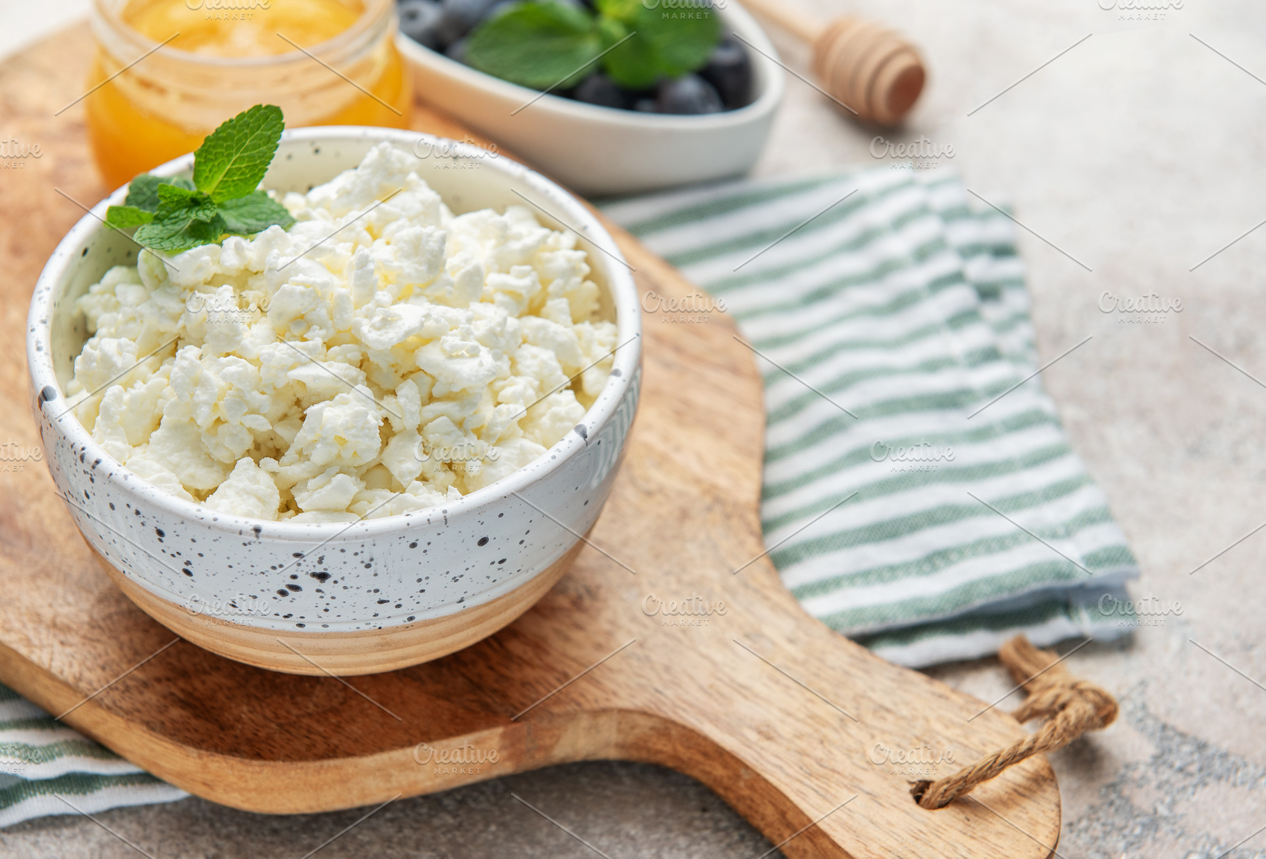 Cottage cheese bowl with mint, honey, and blueberries, a Food & Drink Photo by Olena Rudo