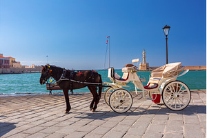 Horse carriage in Chania harbor, an Architecture Photo by kavalenkava