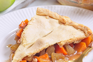 Apple and sweet potato cobbler pie showing filling ingredients, on white plate, a Food & Drink Photo by iuliia_n