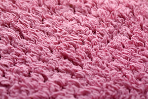 Detailed macro view of soft, pink textured fabric, ideal for bac, a Food & Drink Photo by Ales Munt