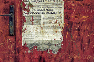 Detail of old used posters on the wa